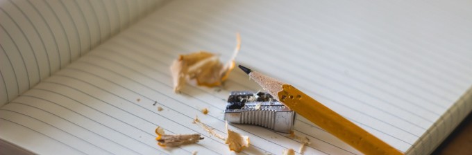 photo of writer's block with pencil, paper, sharpener