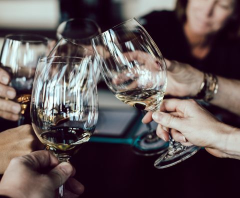 glasses being used in a toast